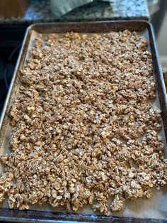 a pan filled with granola sitting on top of a counter