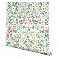 a white and blue floral wallpaper with red, green, yellow, orange and pink flowers on it