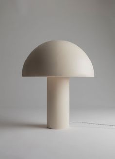 a white mushroom lamp on a gray background