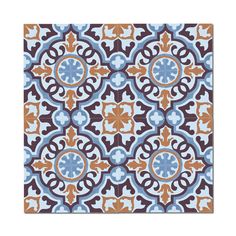 a blue, brown and white tile with an ornate design on it's surface