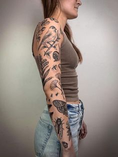 a woman with a tattoo on her arm