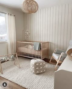 a baby's room with a crib, rocking chair, and bed in it