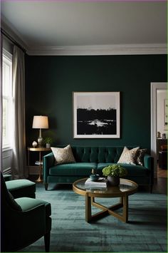 a living room with dark green walls and furniture in the corner, along with a painting on the wall