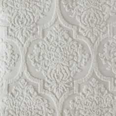 an intricate white wallpaper pattern