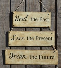 a wooden sign that says, heal the past live the present dream the future