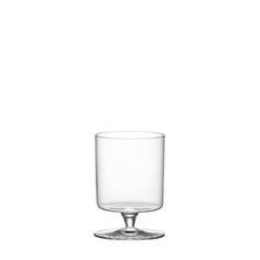 an empty glass sitting on top of a table