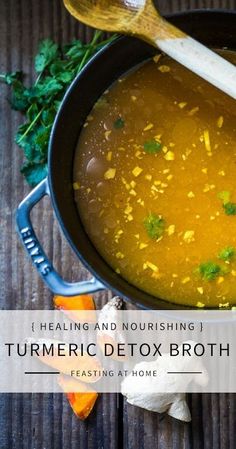 broth based soup in a pot with a wooden spoon and parsley on the side