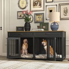 two dogs sit in their kennels on the floor next to a vase with flowers