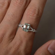 This is a gorgeous handmade creation. Its beauty is its simplicity & Elegance. The 6*8mm cushion cut natural green amethyst is crafted in sterling silver with rhodium plated. It's made to order and it will take about 7-10 days to make it. All item is sent in a beautiful gift box You can realize more lovely stuff clicking the link https://www.etsy.com/shop/knightjewelry?refshopsection_shophome_leftnav Please leave the correct address and you phone number for delivering successfully. Emerald Cut Green Amethyst Jewelry With Accent Stones, Green Amethyst Rings With Gemstone Accents For Wedding, Green Amethyst Wedding Rings With Gemstone Accents, Green Amethyst Rings For Wedding, Silver Cushion Cut Ring With May Birthstone, Elegant Green Amethyst Ring In Sterling Silver, Silver Cushion Cut Ring For May Birthstone, Green Emerald-cut Amethyst Ring For Wedding, Wedding Emerald Cut Green Amethyst Ring