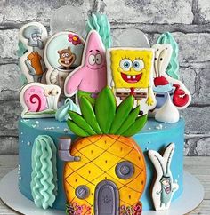 a cake decorated with spongebob and other cartoon characters