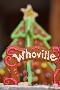 a close up of a decorated cookie with the word whowllle on it