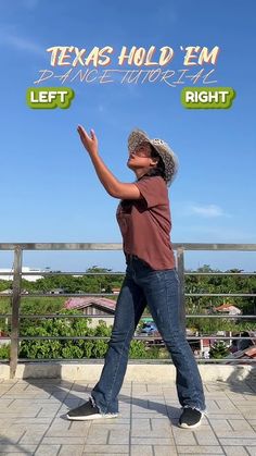 a man standing on top of a roof with his arms in the air and hands out