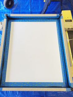 the frame is being prepared to be painted with blue and white dots on it's edges