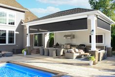 an outdoor living area next to a swimming pool