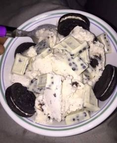 a bowl filled with ice cream and oreo cookies