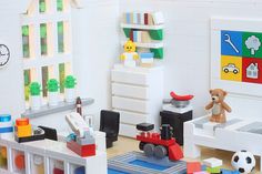 there is a toy room with toys on the floor and in front of it are legos