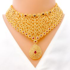 This necklace set, crafted in 22k yellow gold, weighs a substantial 90.0 grams and features a fascinating curved motif. It is richly adorned with uncut diamonds (Polki), totaling 24.78 carats, and rubies weighing 14.08 carats, creating a vibrant contrast. The set boasts a length of 16 inches, with a drop length of 1.25 inches, and is secured with a hook lock and adjustable links for a custom fit. Completing the ensemble are matching earrings, each 1.6 inches long, equipped with a screw back for Festive Gold Diamond Temple Necklace, Opulent Gold Jewelry With Elegant Design, Luxury Necklaces For Festivals And Receptions, Heavy Diamond Kundan Necklace In Gold, Heavy Gold Kundan Necklace With Diamonds, Heavy Gold Diamond Jewelry, 22k Gold Plated Jewelry For Wedding, Heavy Yellow Gold Necklace For Gift, Traditional Gold Diamond Bridal Necklace