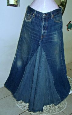 a woman's jean skirt is on display in a room with tile flooring