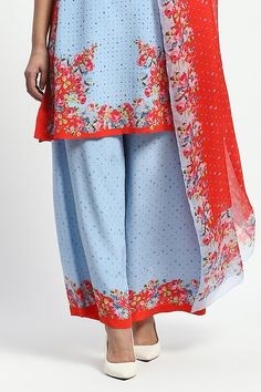 Powder blue and red three fourth sleeves kurta with all over European rose garden print and embellishments detailing. Paired with a matching flared pant and a printed dupatta. - Aza Fashions Blue Printed Palazzo Set For Summer, Summer Blue Palazzo Set With Printed Motifs, Spring Printed Blue Dupatta, Blue Floral Print Palazzo Set For Spring, Spring Blue Floral Print Palazzo Set, Blue Printed Dupatta For Summer, Blue Floral Embroidered Palazzo Set For Summer, Blue Floral Embroidery Palazzo Set For Summer, Blue Printed Palazzo Set For Festive Occasions