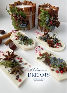 christmas decorations made out of chocolates and candy canes on a white counter top