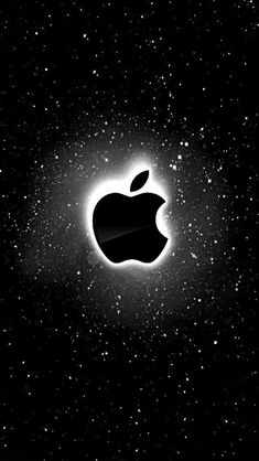 an apple logo in the middle of a black and white photo with stars around it