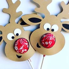 two reindeer shaped lollipops on top of each other with eyes and noses