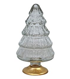 a clear glass christmas tree on a gold base