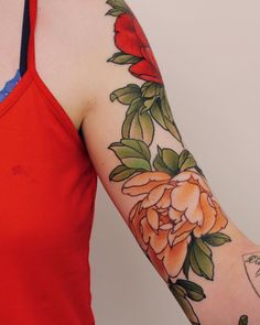 a woman's arm with flowers painted on it