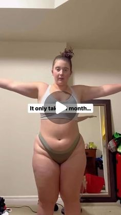 a woman with her arms out in front of a mirror and the words it only take 1 month