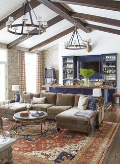 a living room filled with furniture and a large rug