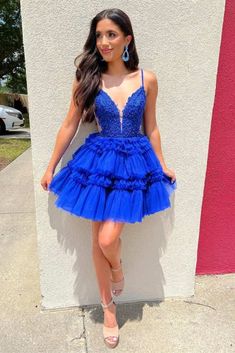 Elevate your homecoming look with the Rilletta Plunging Neck Blue Applique A-line Ruffle Homecoming Dress. This stunning A-line dress is made from delicate tulle fabric in beautiful blue color. The plunging V-neckline adds a daring touch, while the ruffle details add a touch of elegance and charm to this dress. The spaghetti straps and sleeveless design ensure a comfortable fit, and the lace-up back offers a customizable fit. The Rilletta dress is a timeless choice for a memorable evening! Details: Silhouette: A-line Style Fabric: Tulle Fabric Color: Blue Color Length: Short Mini Length Neckline: Spaghetti-Straps Neckline Sleeves: Sleeveless Back: Lace-up Back Embellishment: Ruffles Royal Blue Hoco Dress, Blue Hoco Dress, Blue Satin Prom Dress, Blue Lace Prom Dress, Hoco Dress Inspo, 8th Grade Formal Dresses, 8th Grade Formal, Year Vision Board, 8th Grade Dance