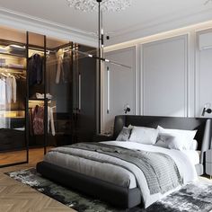 a bedroom with a bed, closet and chandelier