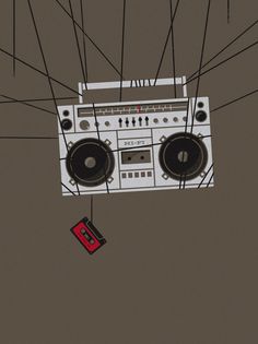 an old fashioned boombox with speakers hanging from it's sides and wires above