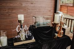 a table with candles and signs on it