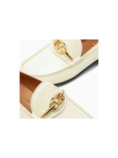 Step into luxury with these stunning ivory leather loafers featuring a chic golden signature Vlogo. The round toe and leather sole provide both style and comfort, making these loafers the perfect addition to any outfit. Leather upper with golden signature Vlogo Round toe for added style Leather sole for comfort and durability | Valentino Garavani Women's Ivory Leather Vlogo Signature Loafer in White | Size IT 36 | 4W2S0IK0MIM Luxury White Loafers With Stitched Sole, Luxury Cream Slip-on Loafers, Luxury Almond Toe Slip-on Tassel Loafers, Luxury Slip-on Loafers With Stitched Sole, Luxury Slip-on Tassel Loafers With Stitched Sole, Prada Designer, Designer Sunglasses, Leather Loafers, Valentino Garavani