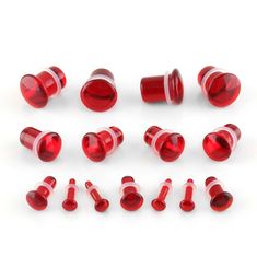 red glass knobs and caps on a white background with clipping for text or image