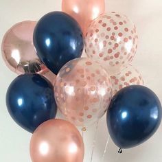 a bunch of balloons that are in the shape of polka dots on a white background