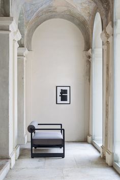 a chair sitting in the middle of a hallway