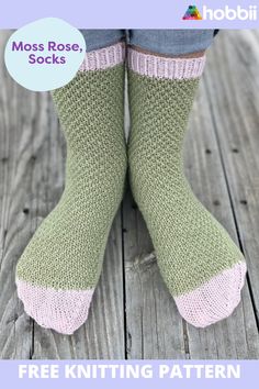 the legs and feet of a woman wearing green knitted socks with pink trims