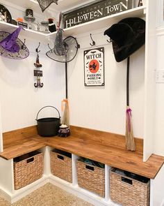 an entry way with baskets and hats on the wall