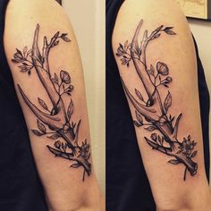 the arm is decorated with flowers and branches