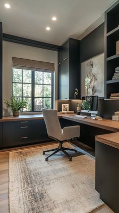 a home office with an area rug, desk and bookcases in the corner