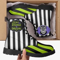 Embrace your unique style with these "Strange and Unusual" gothic combat boots, inspired by the quirky world of Beetlejuice. Featuring bold black and white stripes and the iconic phrase, "I Myself Am Strange & Unusual," these boots are perfect for fans of alternative fashion who want to stand out from the crowd. Crafted from premium vegan leather, these boots combine comfort with durability, making them ideal for daily wear or as a statement piece for your next outfit. Whether you're stepping out for a night on the town or adding a bold touch to your everyday look, these boots are the perfect blend of style and individuality. Product Features: ✅ Eco-friendly PU Leather surface, durable for long time wearing. PU leather is considered vegan-friendly because it doesn't contain animal extracts High-top Boots For Halloween Cosplay, Strange Shoes, Strange And Unusual, Spooky Stuff, Vegan Boots, Black And White Stripes, Next Clothes, Bold Black, Beetlejuice