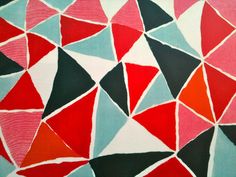 an abstract painting with red, black, and blue triangles on it's surface