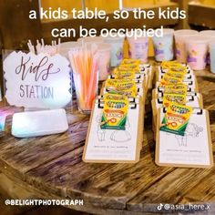 there are some kids's station cards and pens on the table with other items