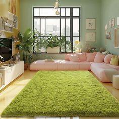 a living room filled with lots of green furniture