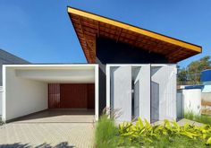 a white house with a wooden roof