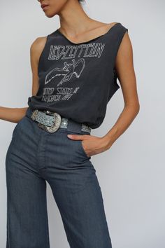 "Vintage t-shirt from the 1979 USA tour for Led Zeppelin. Gender Neutral. Super soft. The perfect vintage tee. For the cut-offs also photographed, go here: https://www.etsy.com/listing/808278277/27-waist-denim-cut-offs-80s-90s-denim?ref=shop_home_active_1 For the blunt lips denim, go here: https://www.etsy.com/listing/807931333/70s-embroidered-jeans-blunt-lips?ref=listing_published_alert Bust: 36\" Length: 25\" Circa: 1979 Condition: Good vintage condition. Normal, average wear with spots, stain Vintage Summer Tops For Concert, Vintage Tops For Summer Concerts, Vintage Cotton Muscle Tee With Graphic Print, Vintage Cotton Top For Music Festival, Cotton Vintage Top For Music Festival, Retro Band Logo Top For Summer, Graphic Tee With Vintage Print For Concert, Retro Cotton Muscle Tee With Graphic Print, Band Logo Cotton Tops For Festival