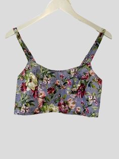 100% Cotton Bralette. Hem is about 2" below bust and approximately 4" above your waist. Wear it under or over a blouse. Also can be worn on its own. Looks great with high waisted skirts or bottoms. Adjustable straps, button and loop back closure, princess seams. Item pairs nicely with Tie-waist Overskirt. Only 1 left! Fitted Floral Print Cropped Tank Top, Fitted Cropped Floral Print Crop Top, Fitted Floral Print Crop Top, Spring Fitted Top, Bra Friendly, Spring Bra Friendly Fitted Tops, Summer Fitted Top Bra Friendly, Spring Cropped Tops Bra Friendly, Cotton Floral Print Cropped Tank Top, Cotton Cropped Tank Top With Floral Print