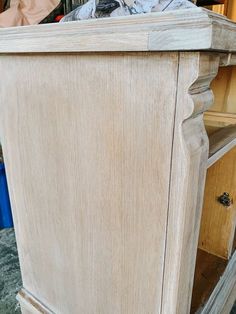 an old wooden cabinet is being sanded down